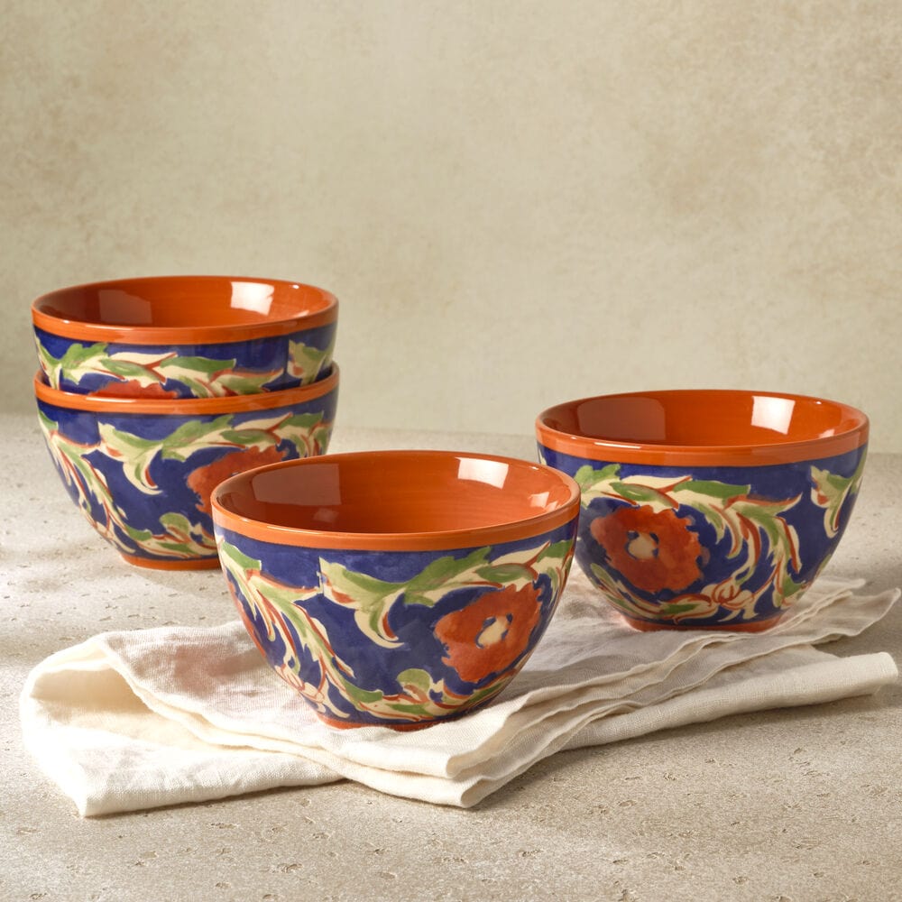 Set of four stoneware fruit bowls on a dining table, showcasing their elegant design