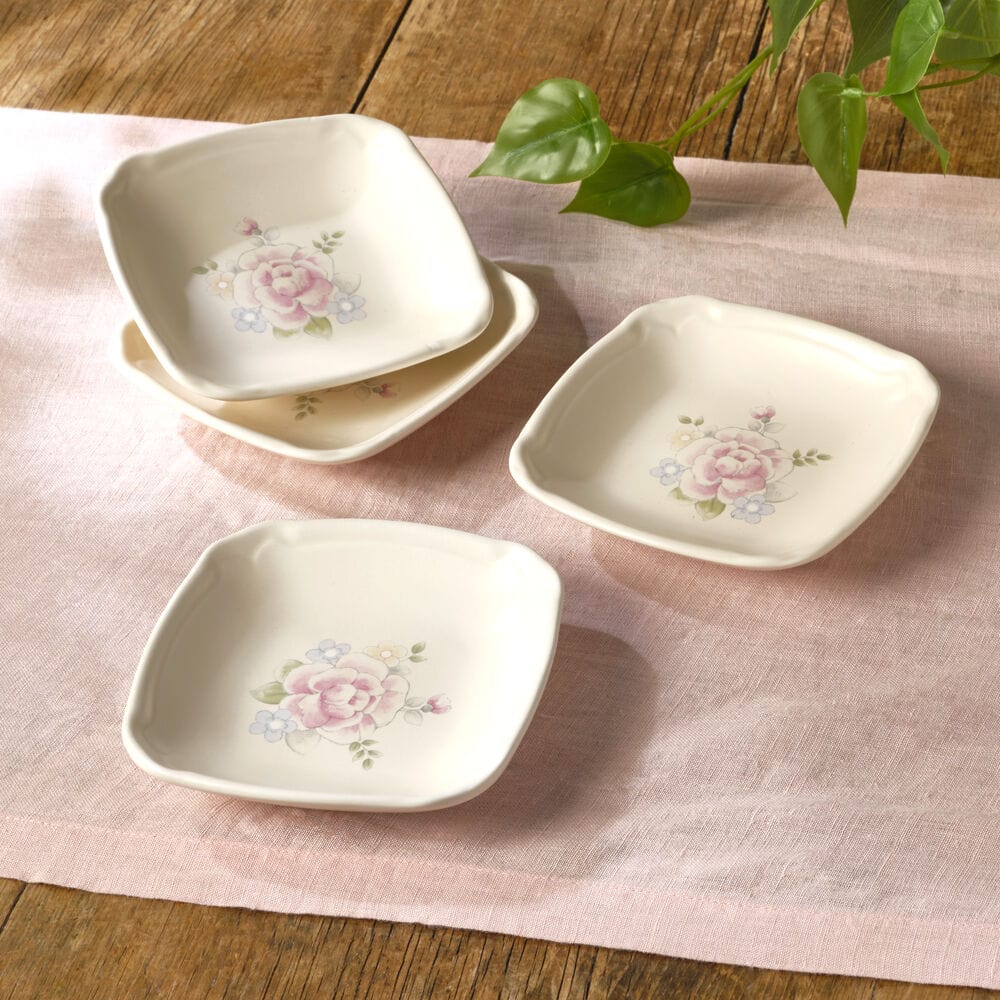Elegant stoneware appetizer plates set of 4, showcasing the square design and perfect for serving various snacks.
