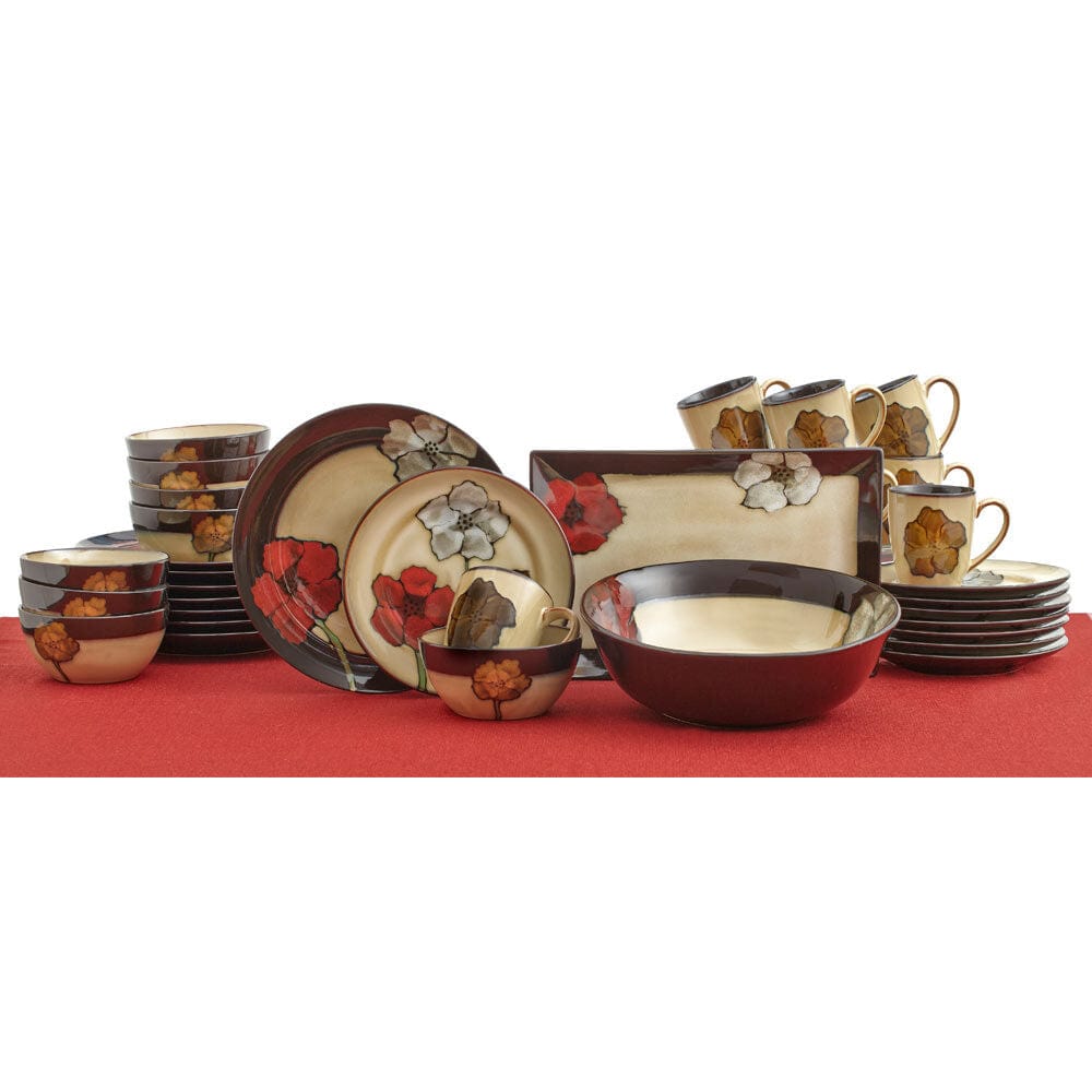Overhead view of the Painted Poppies stoneware dinner set arranged for 8 guests, showcasing handcrafted details and reactive glaze.