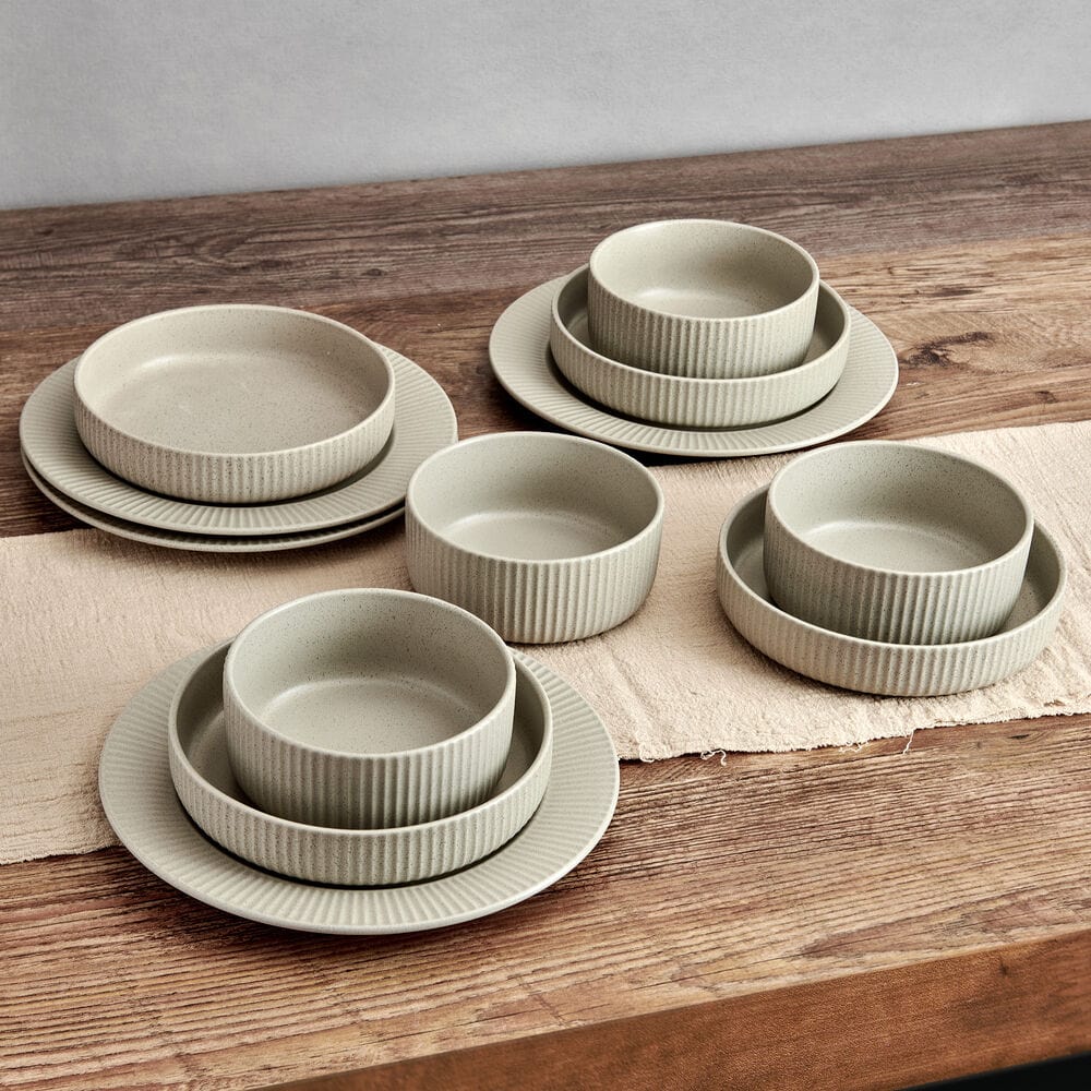 Elegant fluted design of the Serenity 12-Piece Dinnerware Set showcased on a dining table.