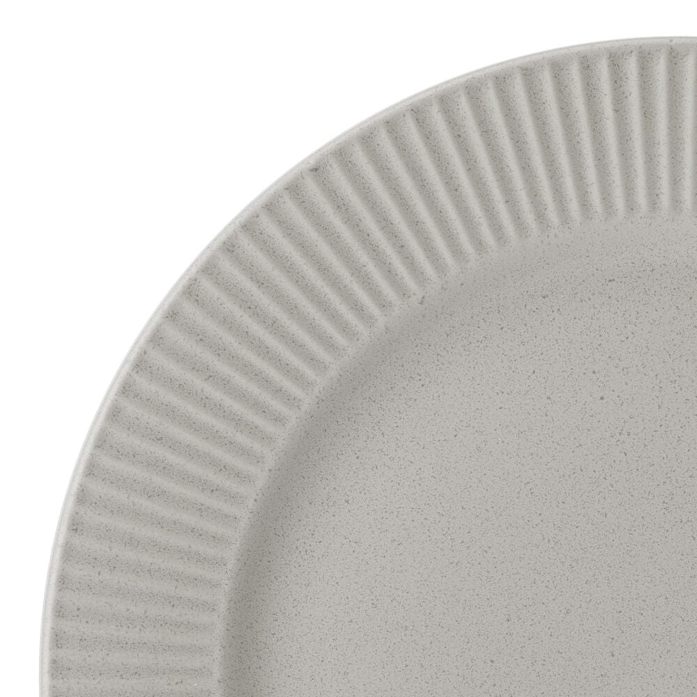 Elegant fluted design of the Serenity 12-Piece Dinnerware Set showcased on a dining table.