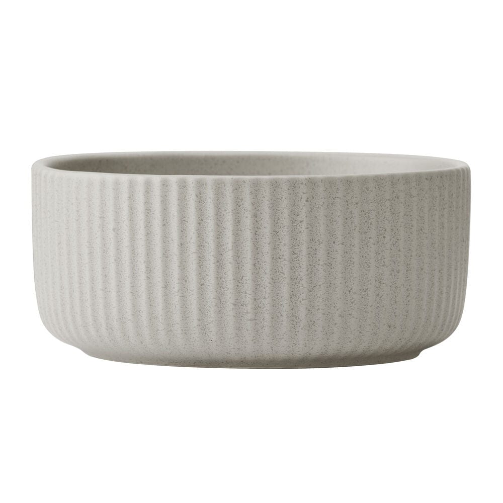 Elegant fluted design of the Serenity 12-Piece Dinnerware Set showcased on a dining table.