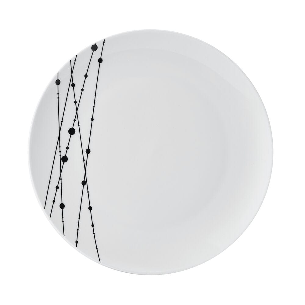 Stacked ceramic dinnerware with unique design on a dining table