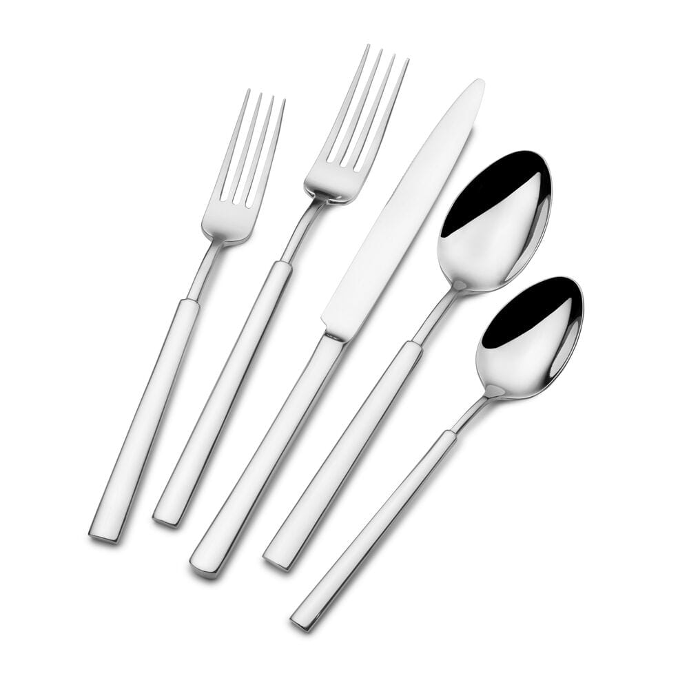 Set of stainless steel flatware arranged neatly on a dinner table