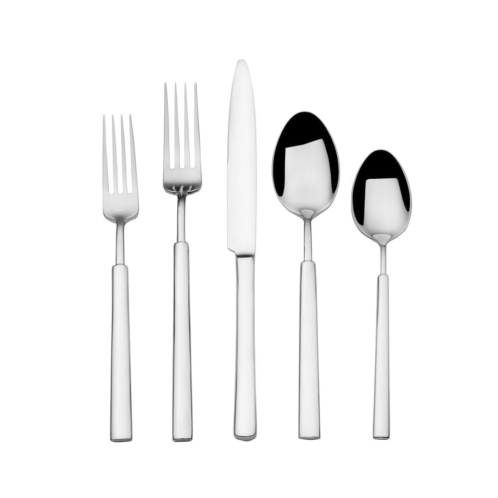 Set of stainless steel flatware arranged neatly on a dinner table