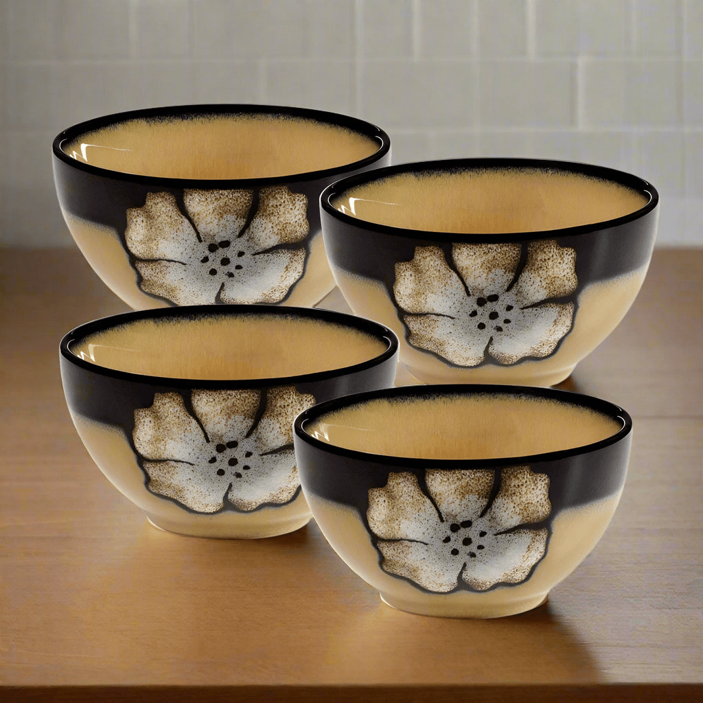 Close-up of painted poppies design on handcrafted stoneware bowl
