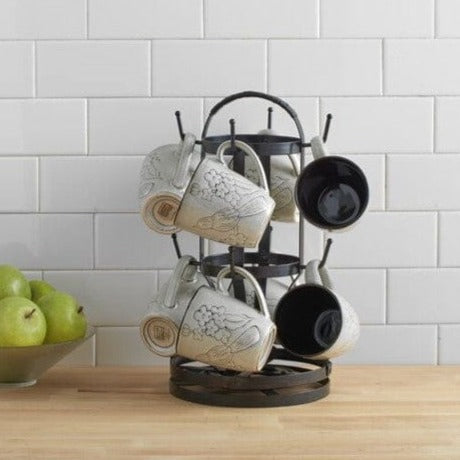 Elegant rotating mug tree showcasing 8 mugs in a bright kitchen setting.