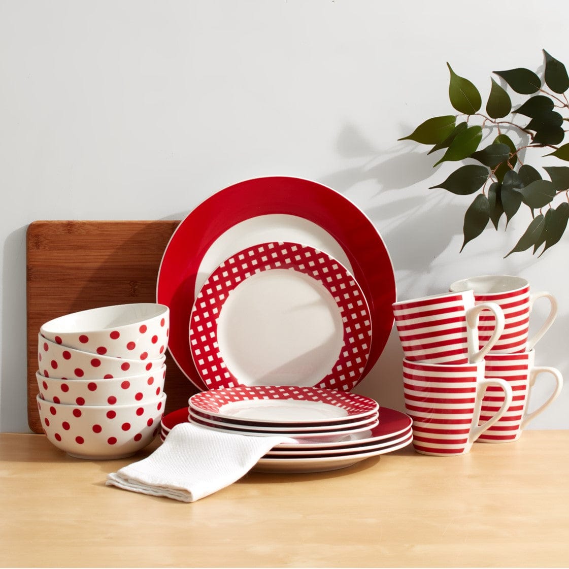 Vivid red porcelain dinnerware set on a modern dining table