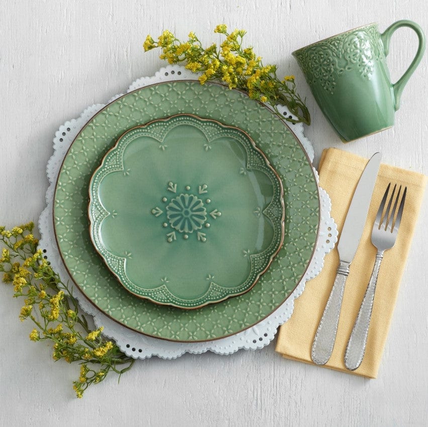 Stylish dishwasher safe green mugs for coffee, placed on a kitchen counter.