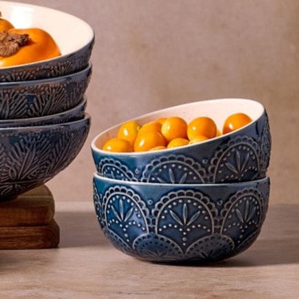 Havana Set of 4 fruit bowls showing unique embossed patterns and blue glaze from a top angle.