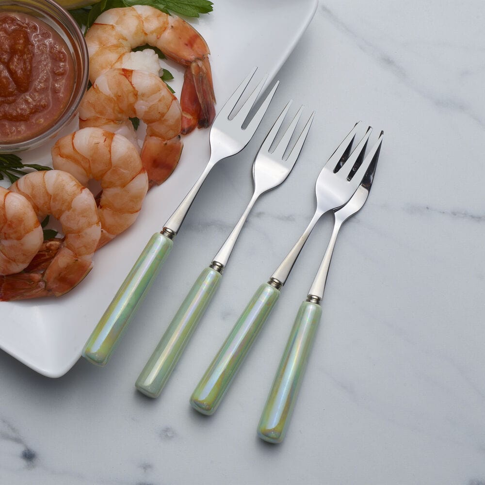 Appetizer forks with ceramic handles in a festive party setting, ideal for hosting