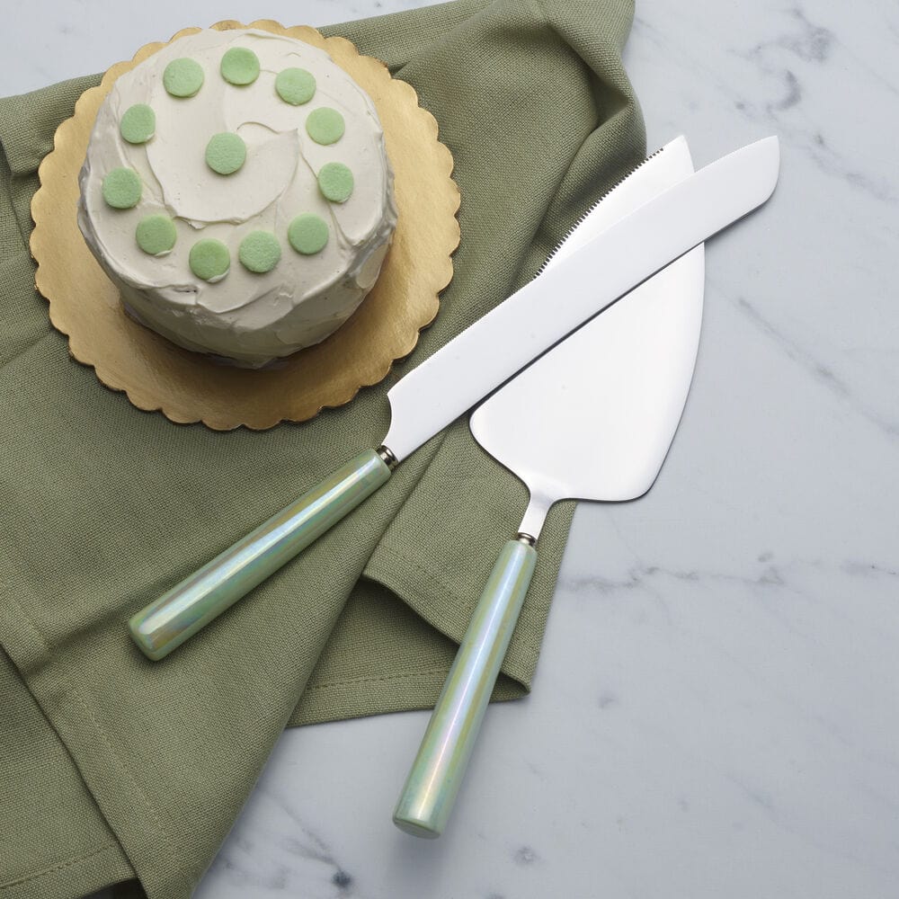 Top-down view of the ceramic handle cake server and knife set on a decorated dessert table