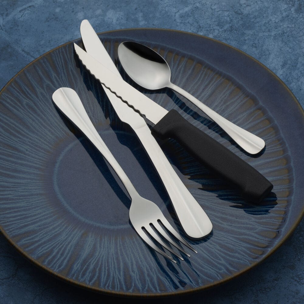 Flatware set arranged neatly on a dinner table, ready for family dinner