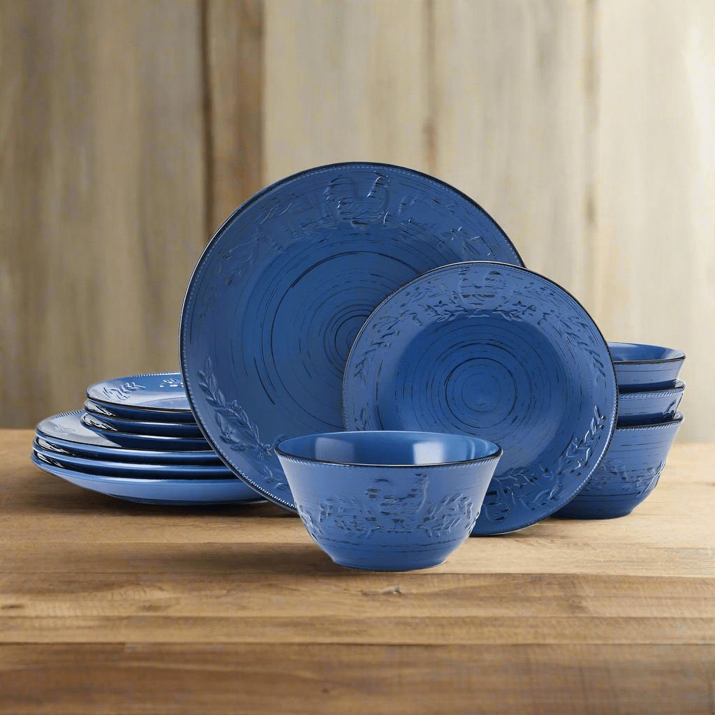 Close-up of blue stoneware dinner plate with rustic rooster design