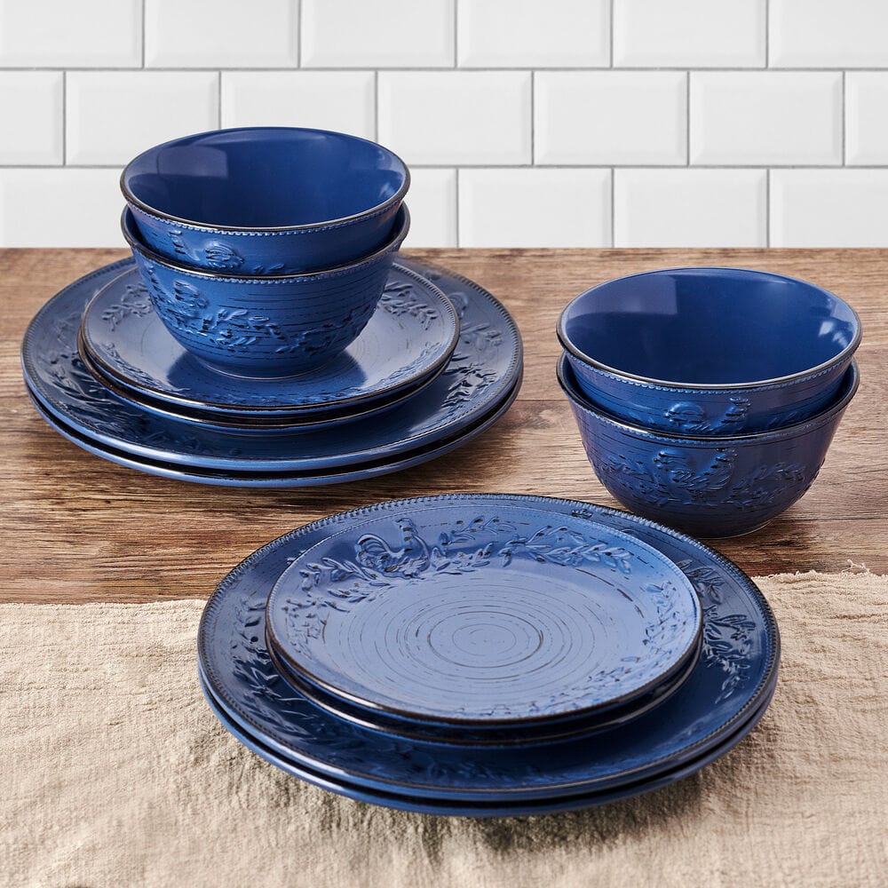 Set of four blue stoneware salad plates with weathered country charm