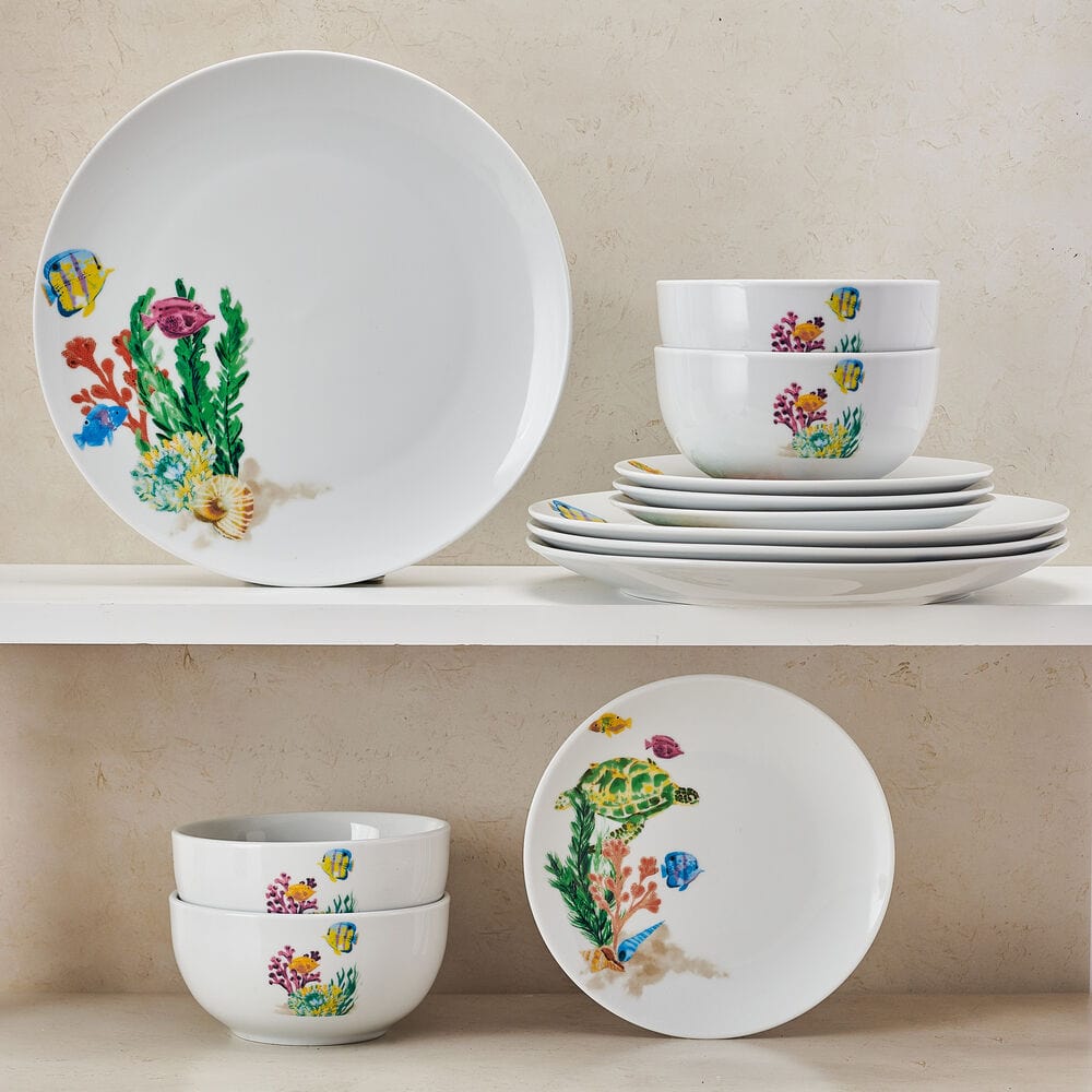 Close-up of colorful fish and sea turtle dinnerware for ocean-themed dining
