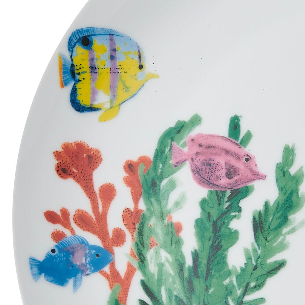 Close-up of colorful fish and sea turtle dinnerware for ocean-themed dining