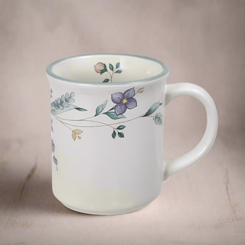 Pastel Blossom Ceramic Coffee Mug showcasing the floral design and pastel band.
