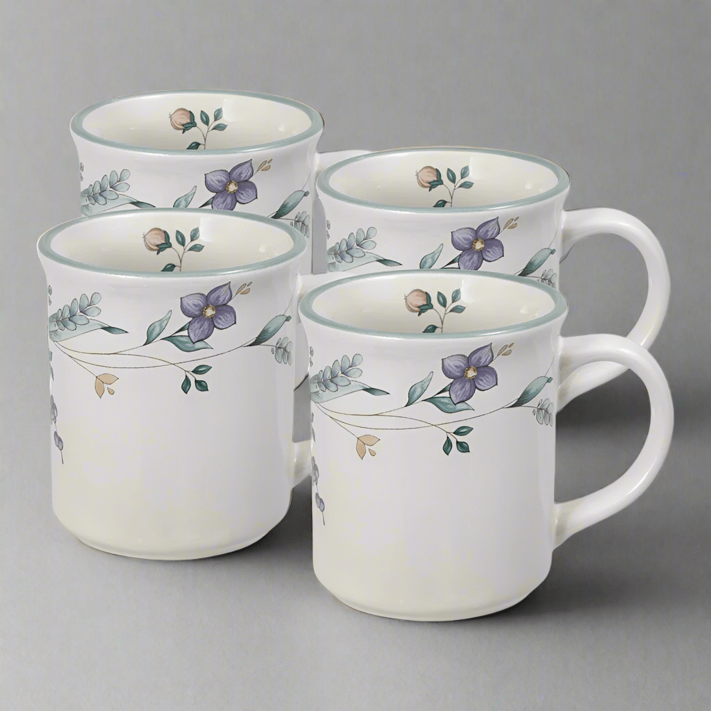 Stylish stoneware mug with pastel band, perfect for coffee lovers.