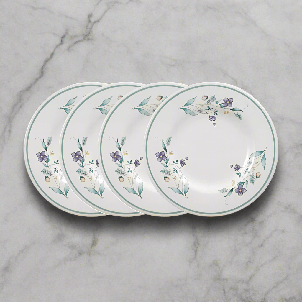 Close-up of 8 inch stoneware salad plates stacked neatly on a dining table