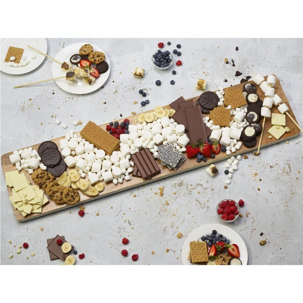 Serving board in use, displaying a cheese platter for a party