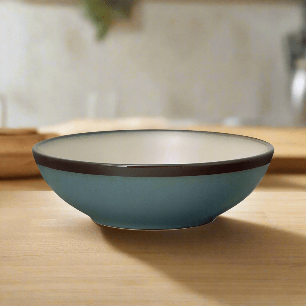 Close-up of the Belmont Blue stoneware pasta bowl highlighting its reactive glaze finish.