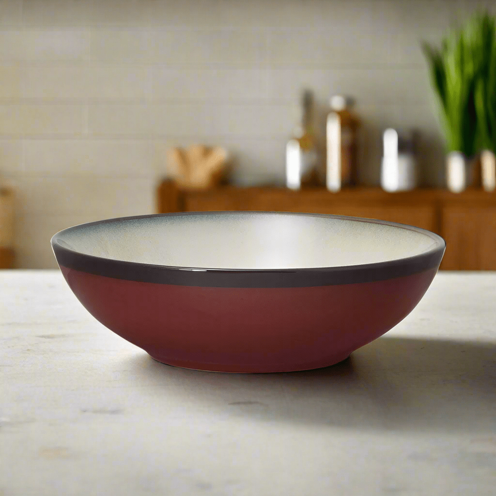 Belmont Red individual pasta bowl from above, highlighting the reactive glaze.