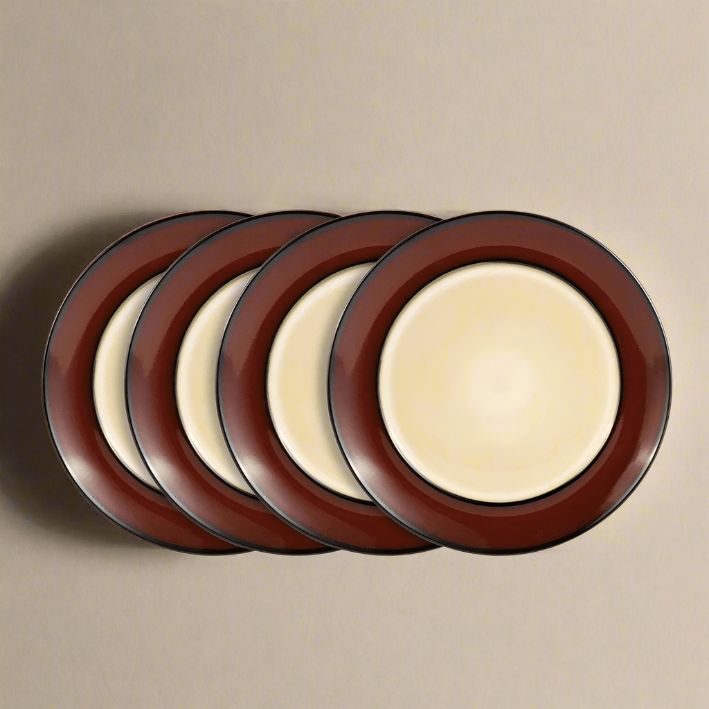 A close-up of a red stoneware dinner plate showcasing the unique reactive glaze finish.