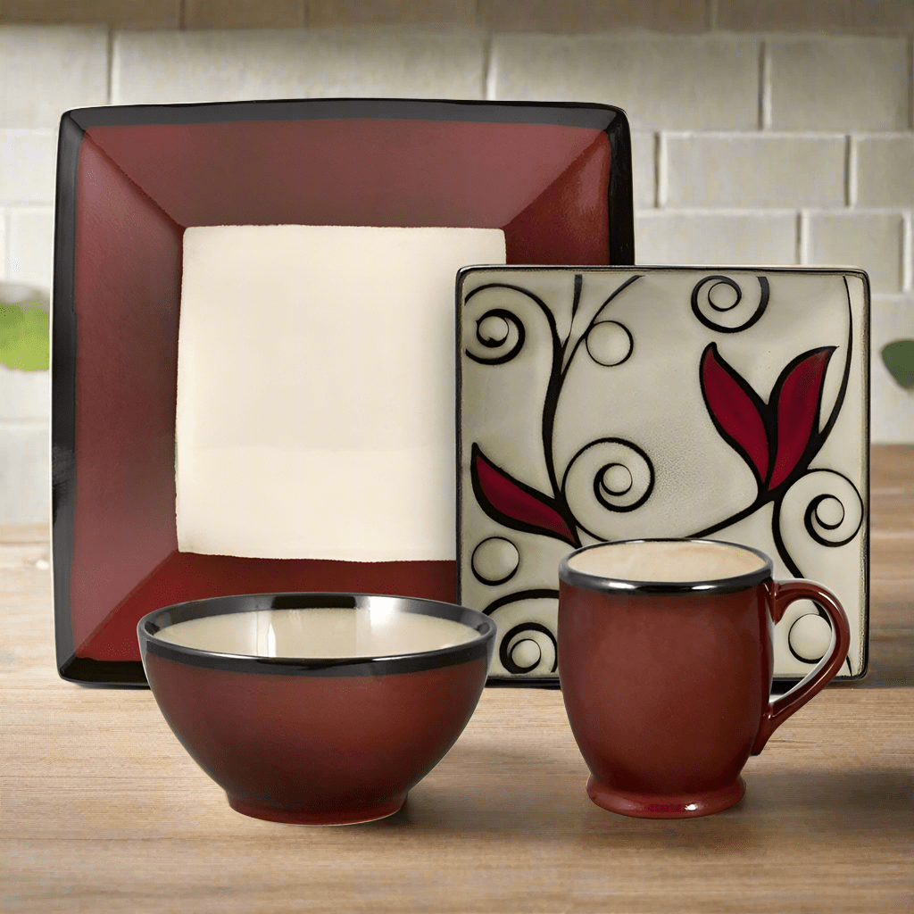 Close-up of handcrafted red dinner plates with reactive glaze design