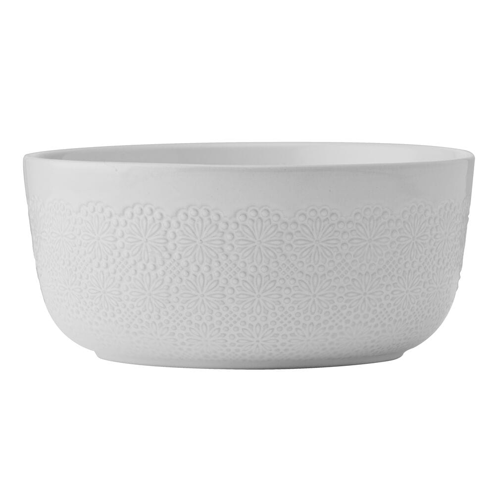Close-up of Blooming Meadow 12-piece dinnerware set on a modern dining table