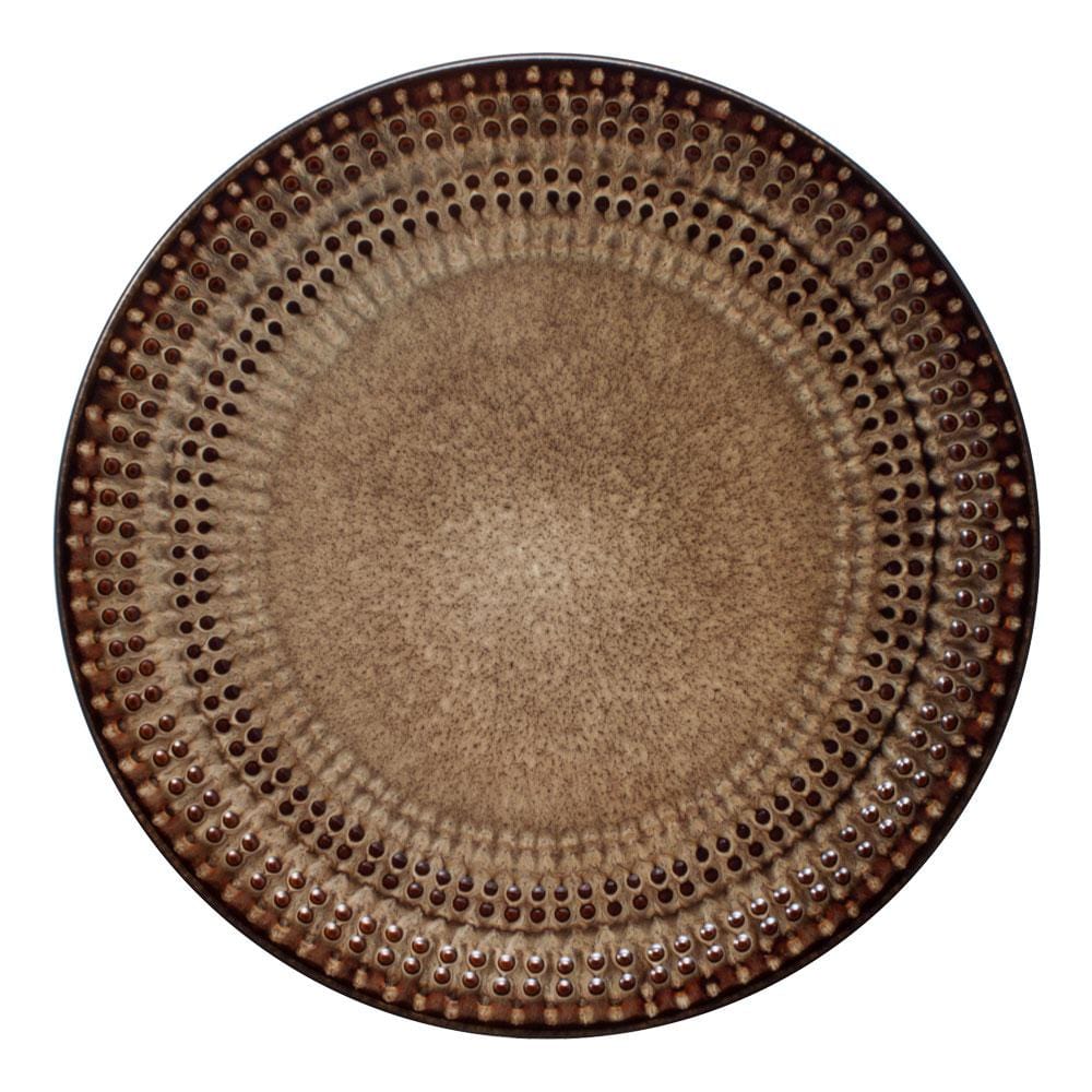 Unique reactive glaze dinnerware set displayed elegantly on a dining table, showcasing its vibrant colors and unique designs.