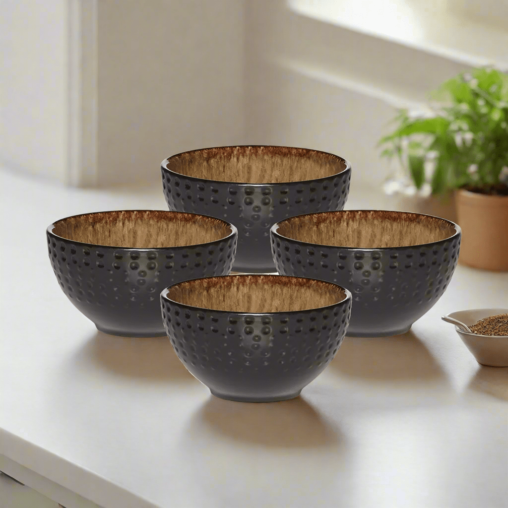Unique handcrafted stoneware fruit bowl set with reactive glaze, showcasing individual color variations.