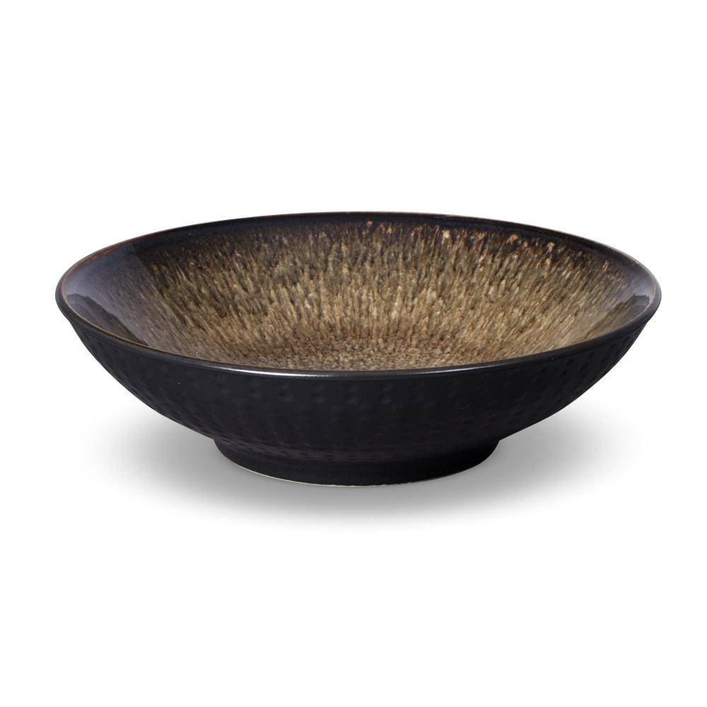 Unique reactive glaze dinnerware set displayed elegantly on a dining table, showcasing its vibrant colors and unique designs.