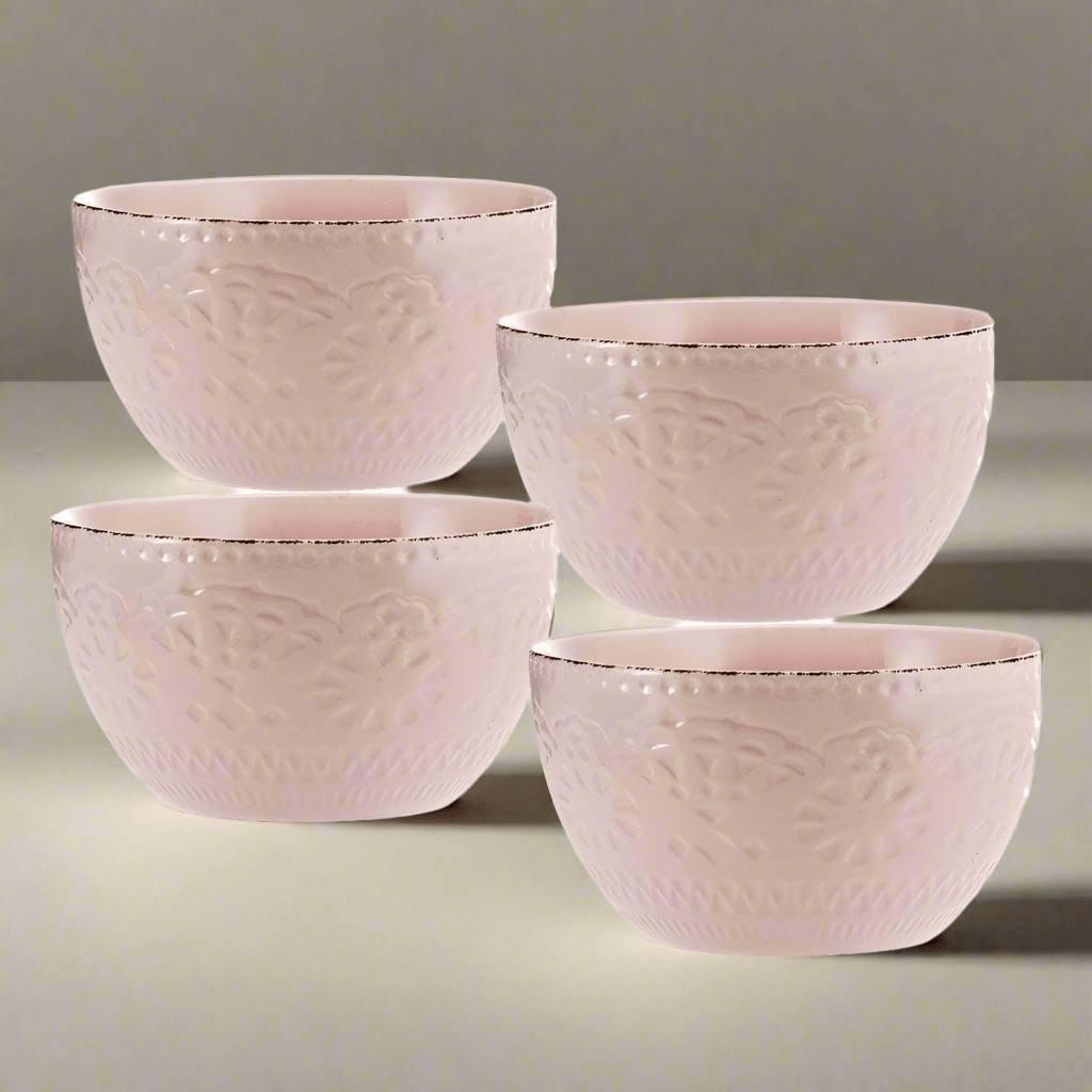 Elegant pink soup bowl set showcasing intricate lace pattern and scalloped edges.