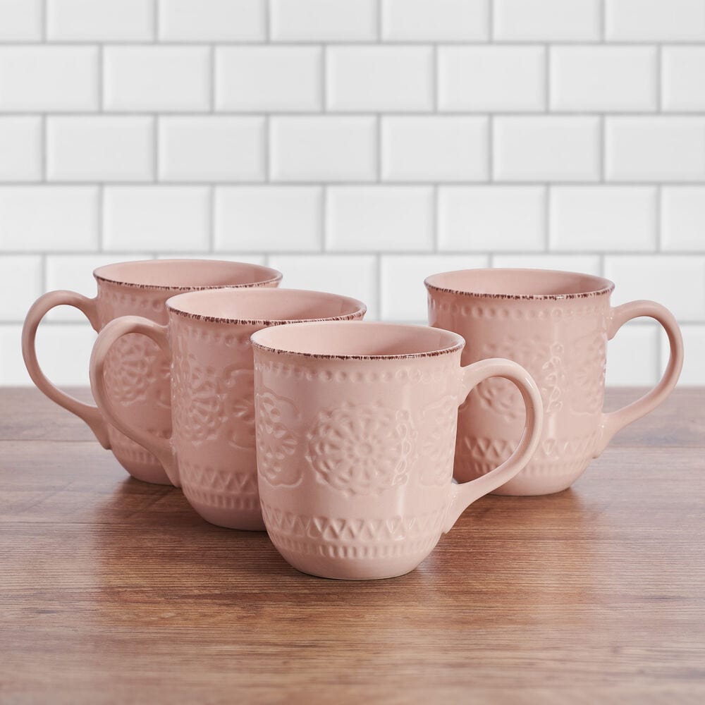 Side view of Chateau Pink stoneware mug showcasing its intricate dimpled pattern and antiqued rim.
