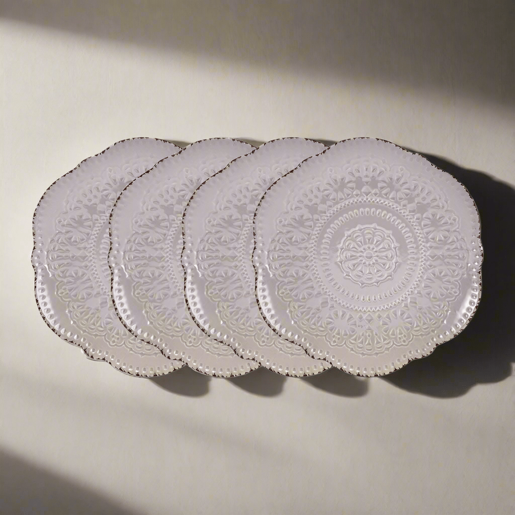 Close-up of Chateau Smoke salad plates showing lace-inspired design and scalloped edges