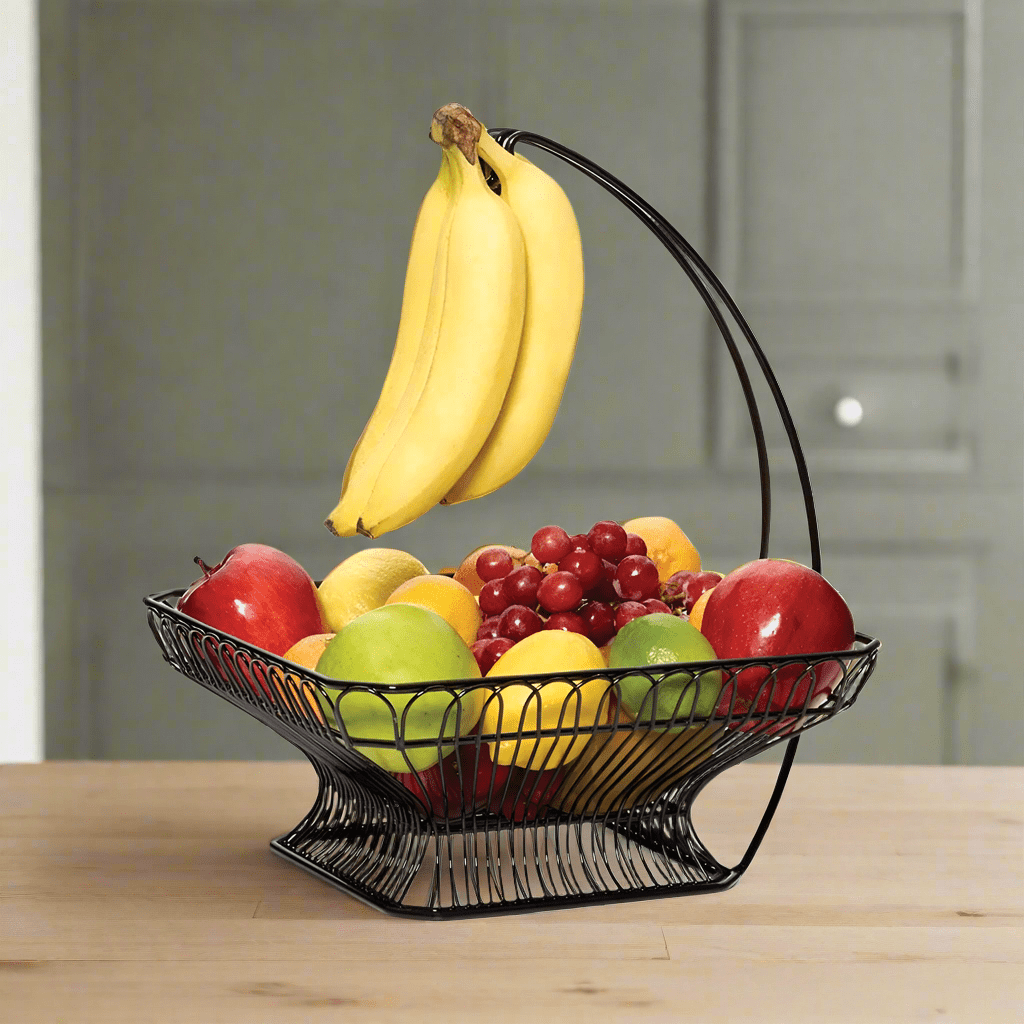 Elegant fruit basket with banana hook on a kitchen countertop, showcasing its stylish design.