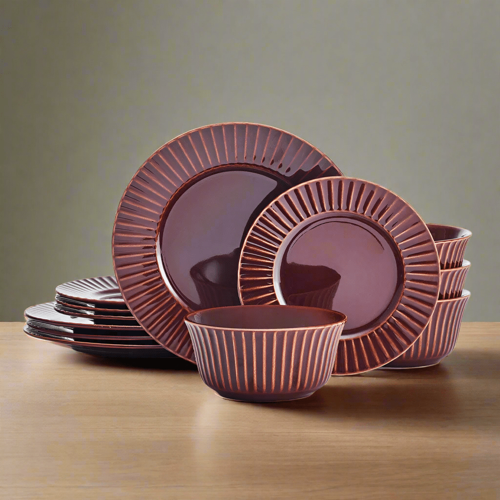 Red stoneware dinnerware set with embossed pattern on dining table