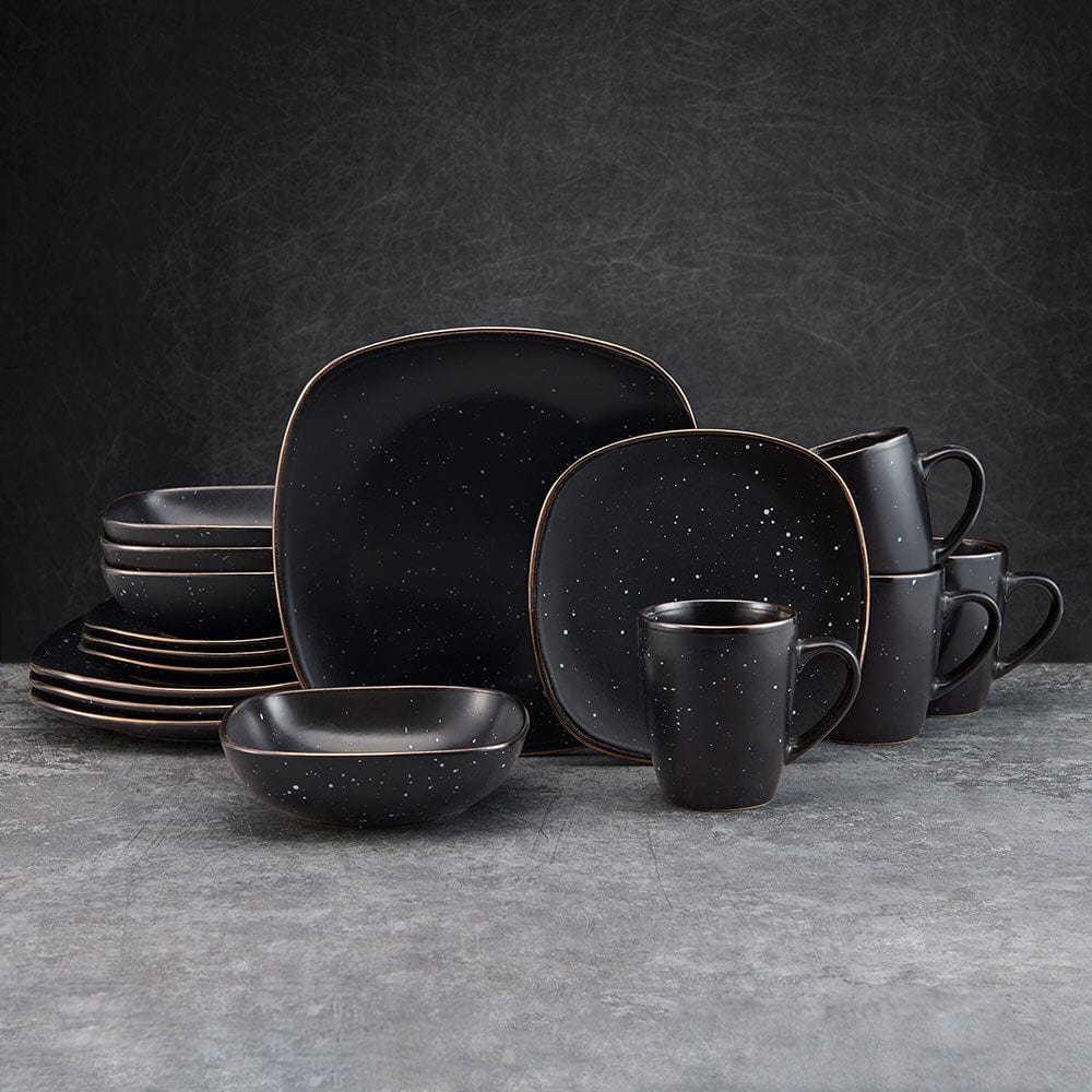 Square black stoneware dinnerware set with speckle design and metallic rims, perfect for everyday use