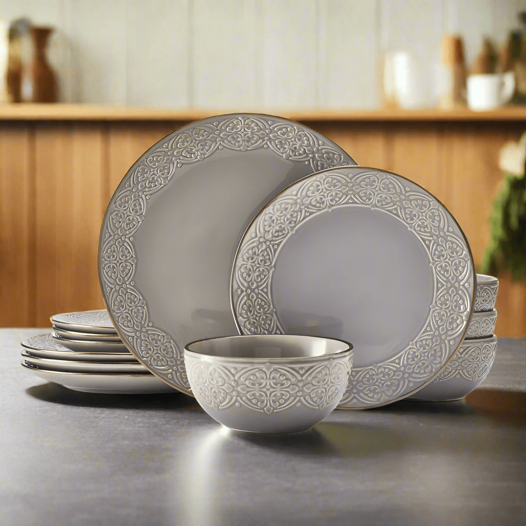 Emma 12-piece stoneware dinnerware set with embossed rims on a modern dining table