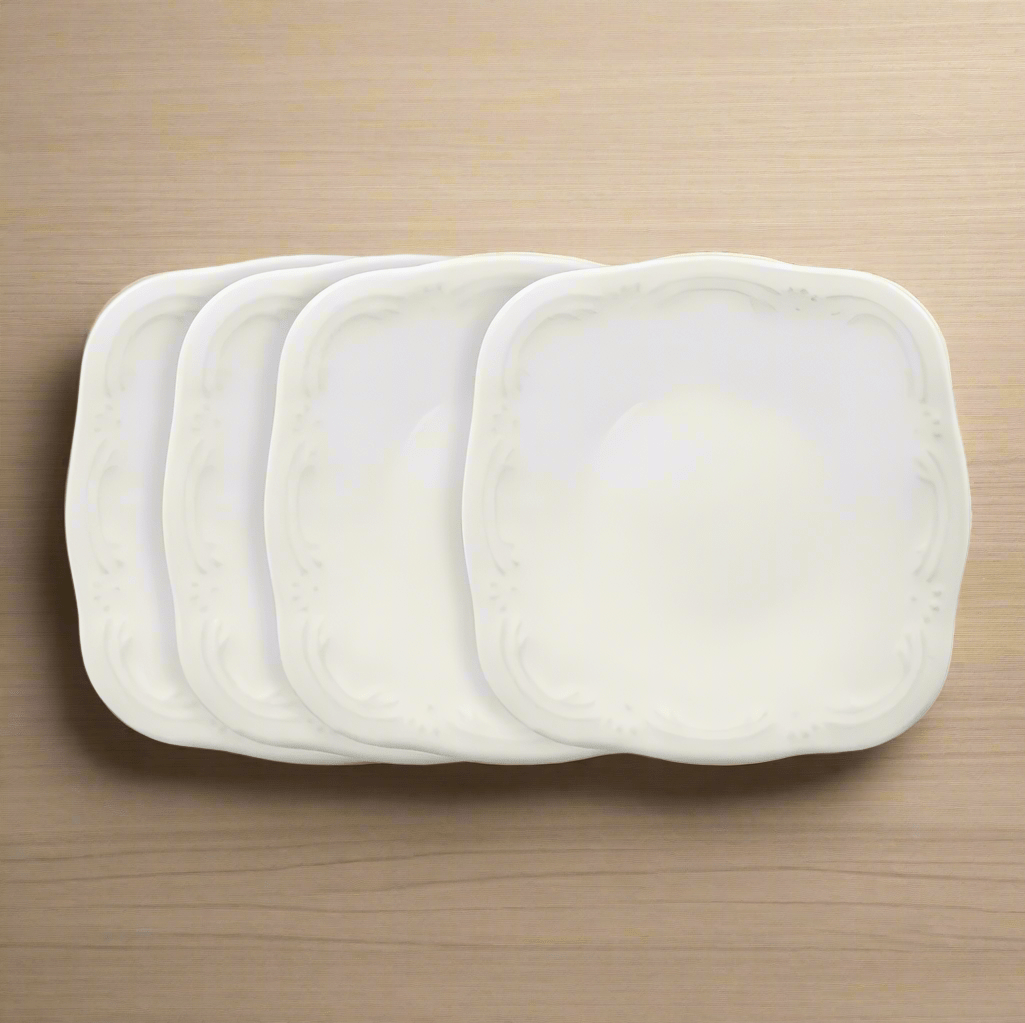 Close-up of 4 stoneware appetizer plates on a table for parties