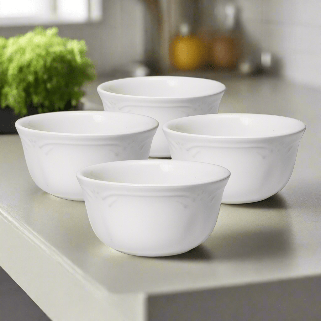 Close-up of elegant filigree design on stoneware dessert bowls