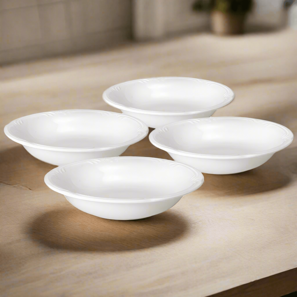 Close-up of elegant filigree design on stoneware pasta bowls