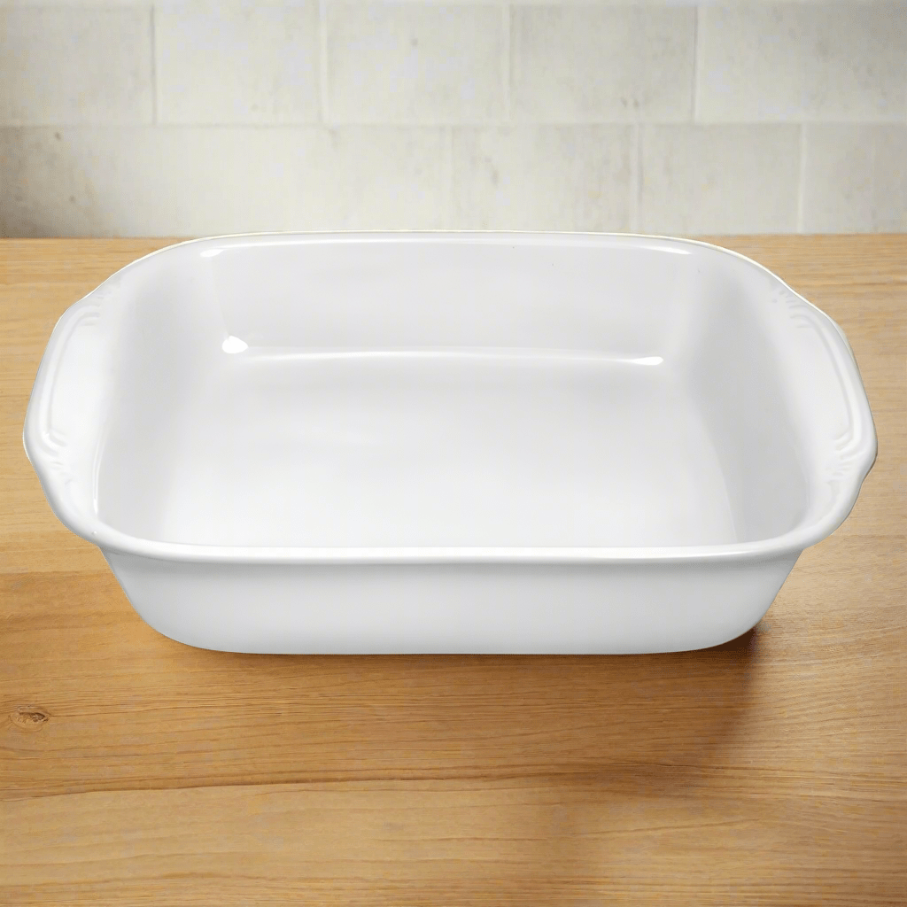 Versatile square stoneware baker with vibrant casserole dish inside, ideal for family meals.