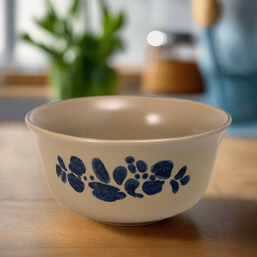 Overhead view of deep stoneware bowl filled with cereal and fruit