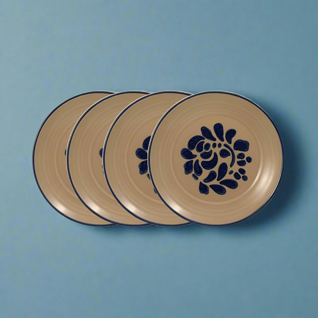 Close-up of Folk Art-style stoneware salad plate, detailed design and durable material