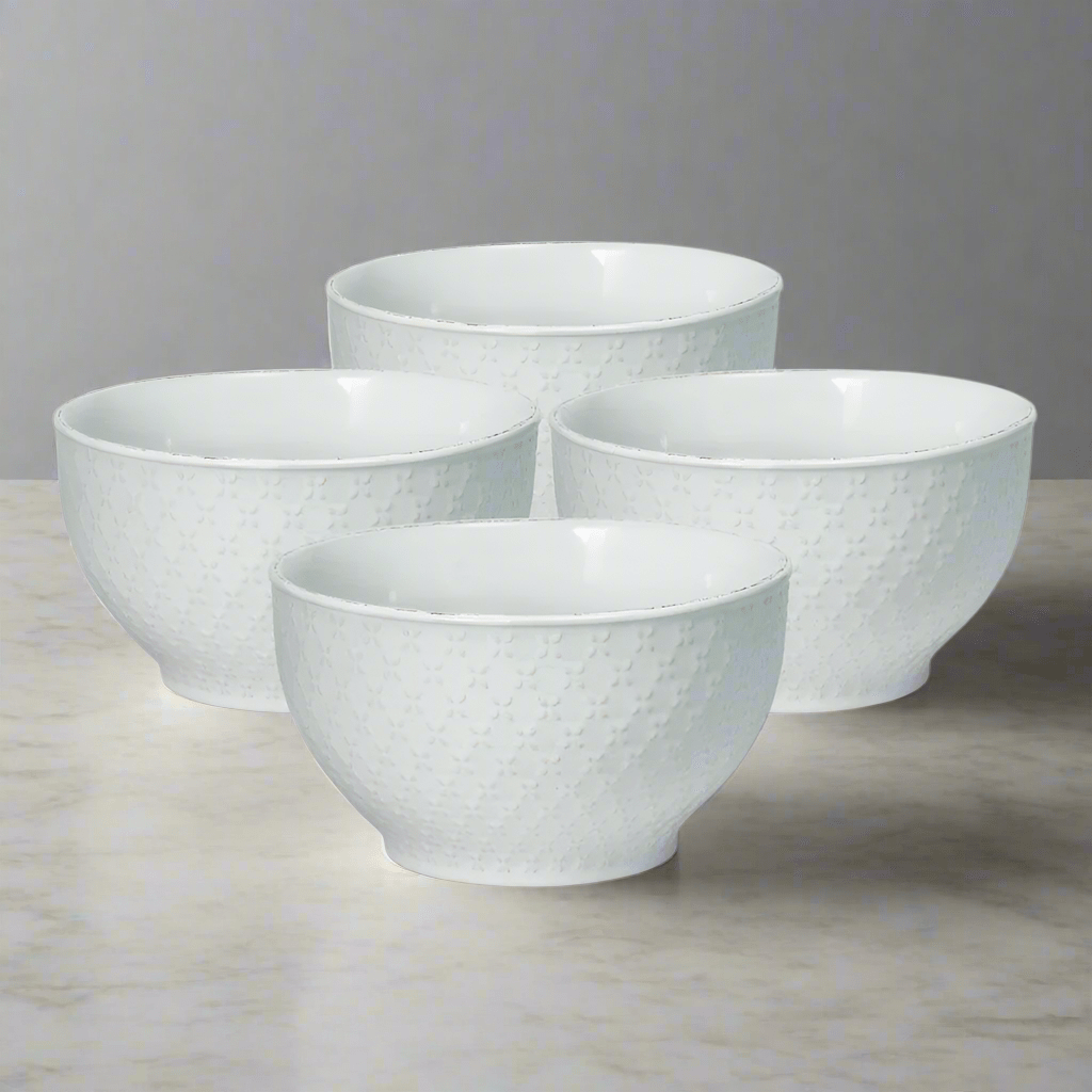 Elegant white ceramic soup bowls with lace pattern for serving hot and cold dishes
