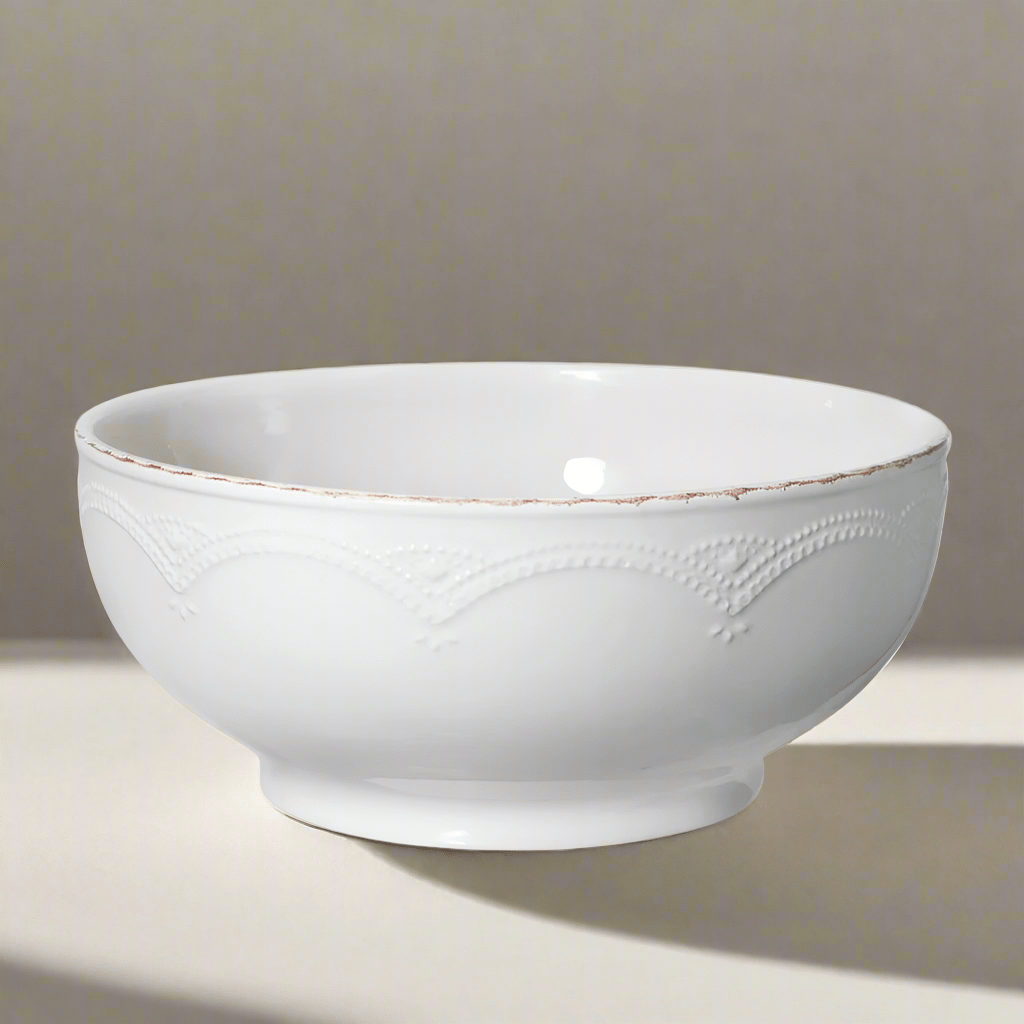 Elegant stoneware bowl showing French lace design from above, perfect for dinner parties.