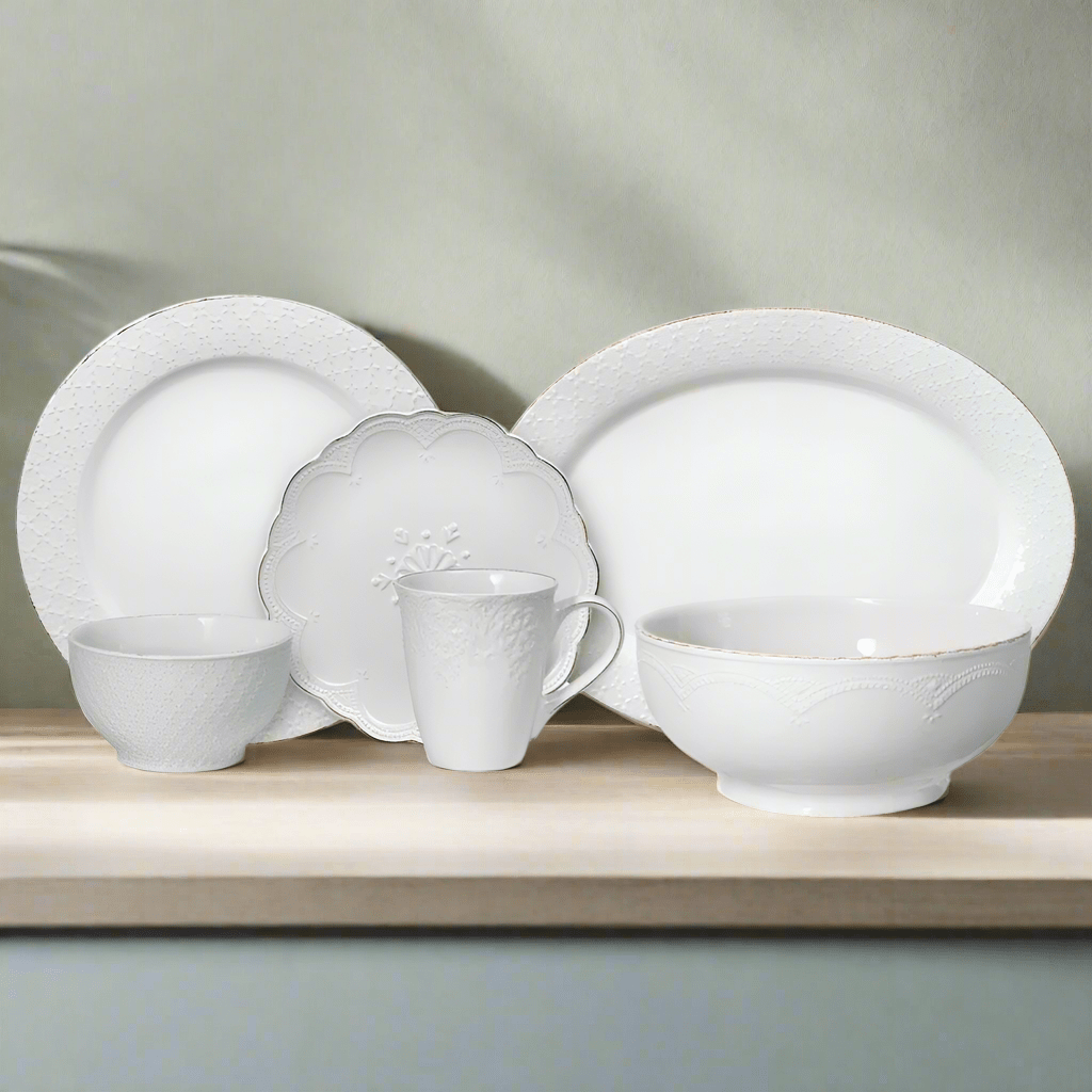 Close-up of white dinner plates and bowls on a dining table