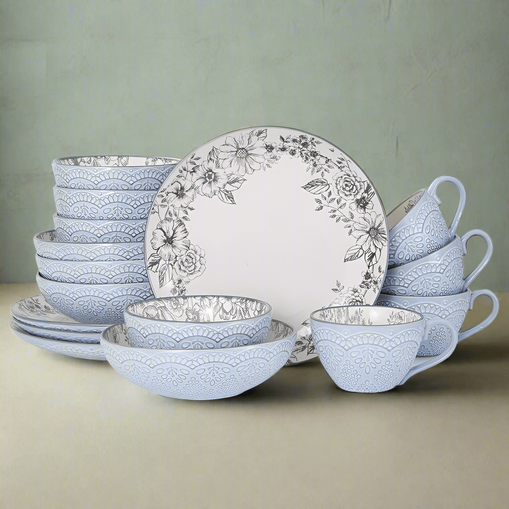 Gabriela Gray dinnerware set showcasing floral design and scalloped edges on a dining table.